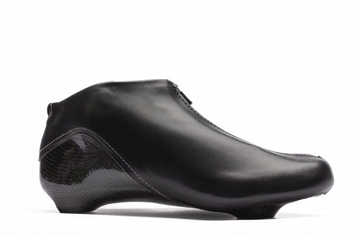 Hurricane long track boot, black, side profile facing right, pale stitching at the heel