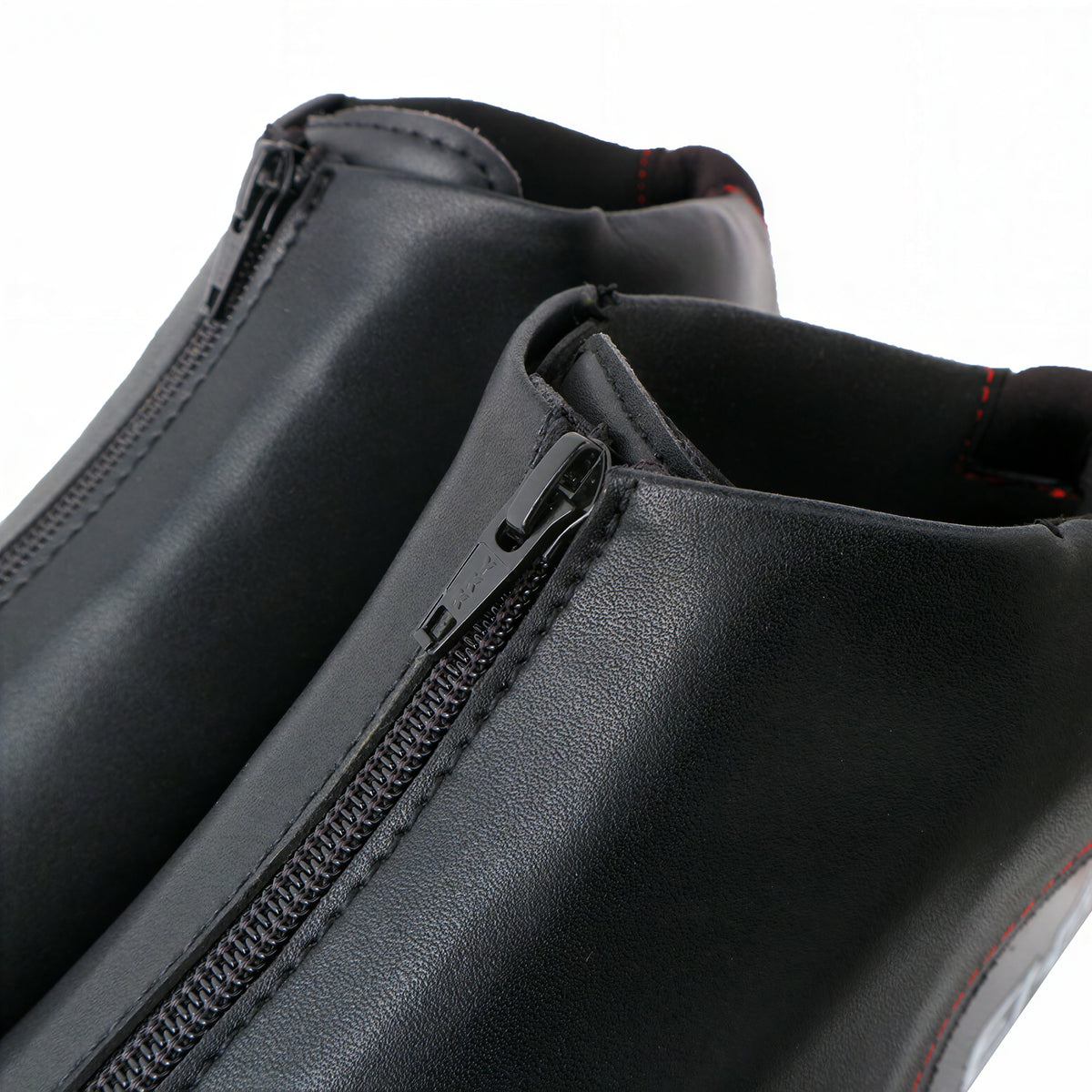 Hurricane long track boots, black pair, close-up of the front zippers
