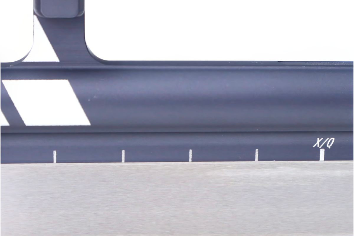 StayBent XQ short track speed skate blade, close-up of the grey tube and runner with the X/Q mark