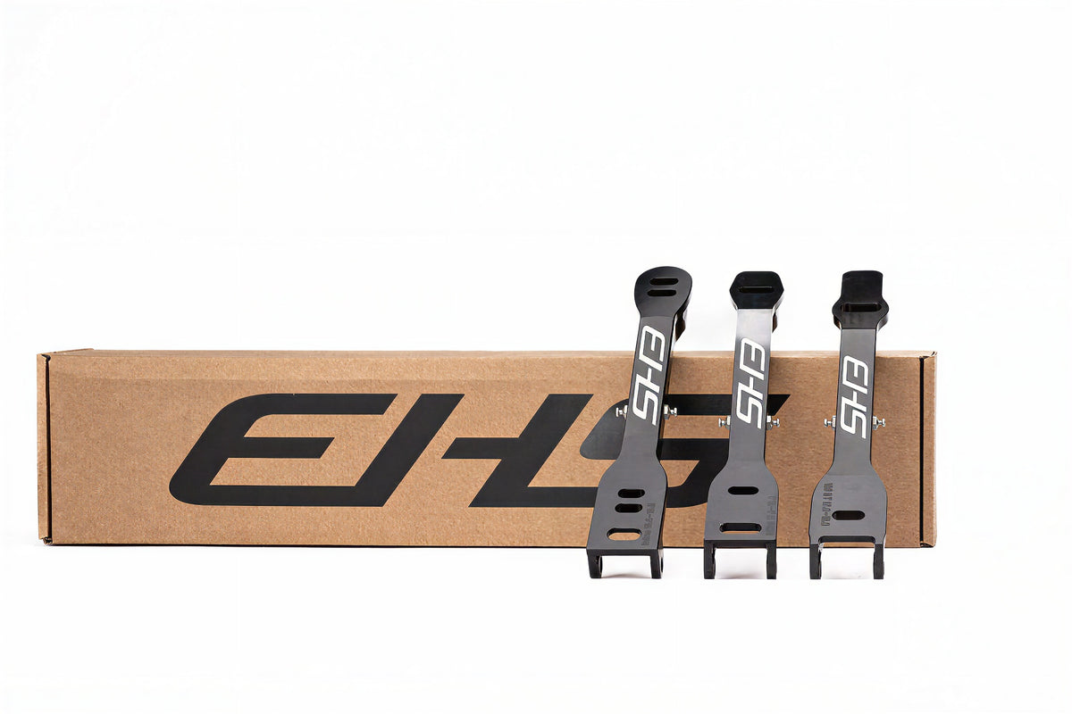 Xplorer long track clap hardware, three black EHS bridges in front of a cardboard box