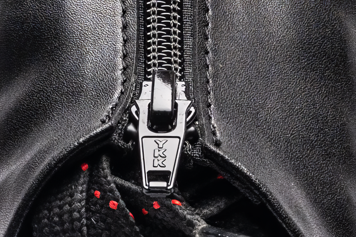 EHS StayBent Hurricane long track speed skate boot, black, macro of YKK zipper pull and dotted laces