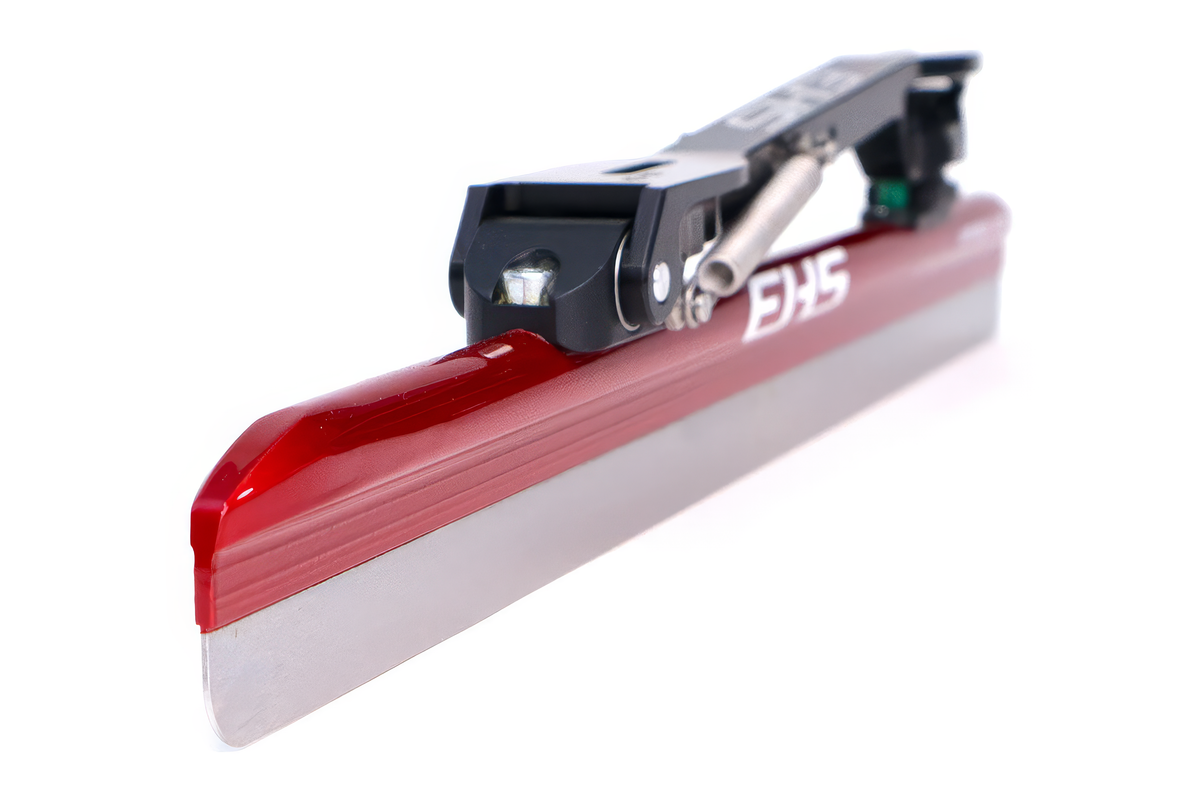 EHS StayBent Superior long track speed skate clap blade, front three-quarter close-up of the red tube, clap hinge and spring
