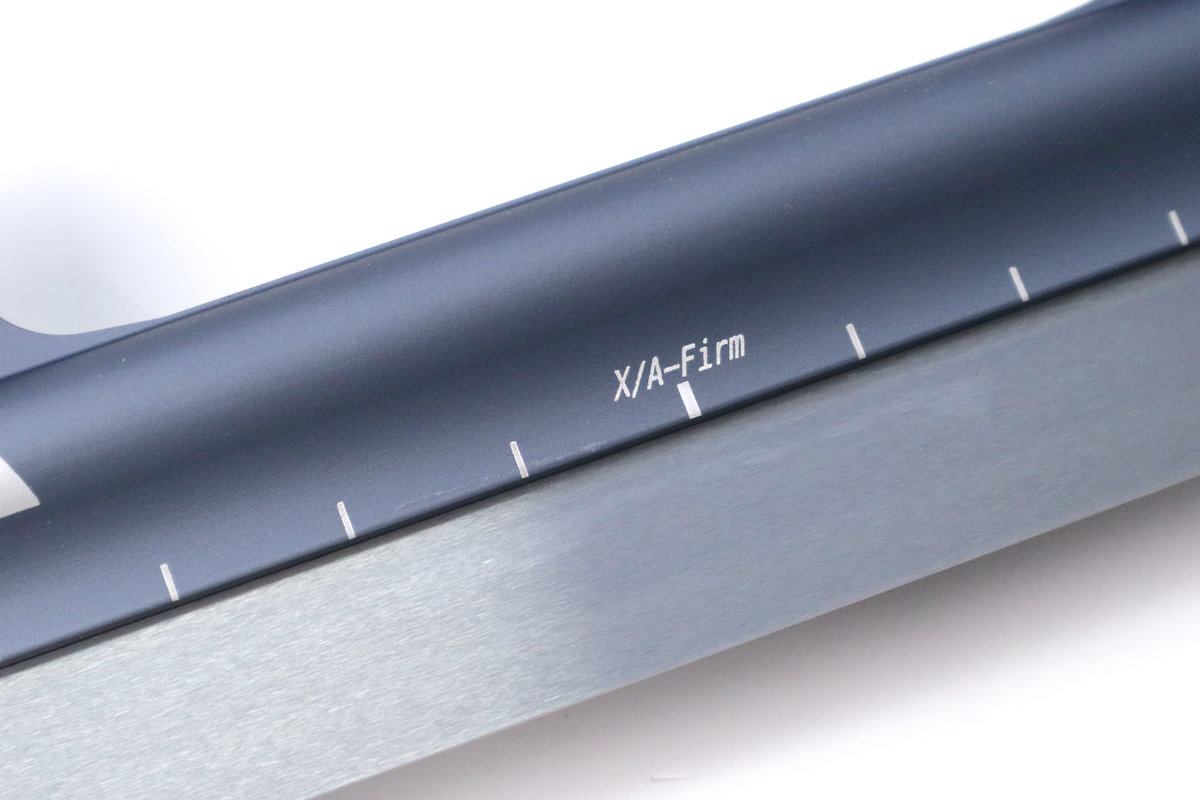 StayBent XA Firm short track speed skate blade, close-up of the grey tube and runner with the X/A-Firm mark