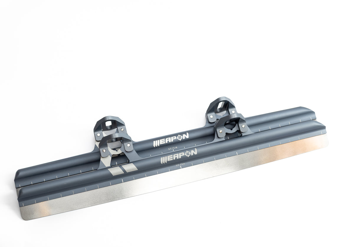 XC Flex Weapon short track blades, pair with cups fitted, three-quarter studio view