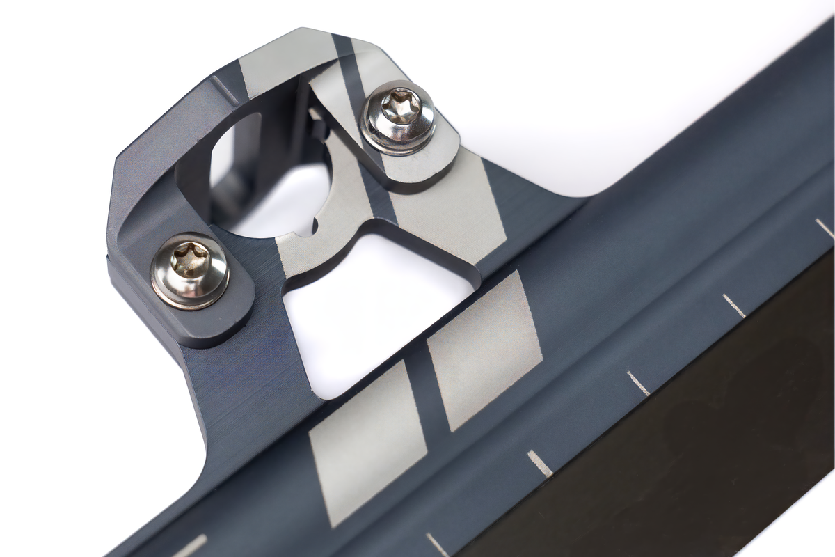 StayBent XC Flex Weapon short track speed skate blade, macro of a cup, chevrons and TX screws